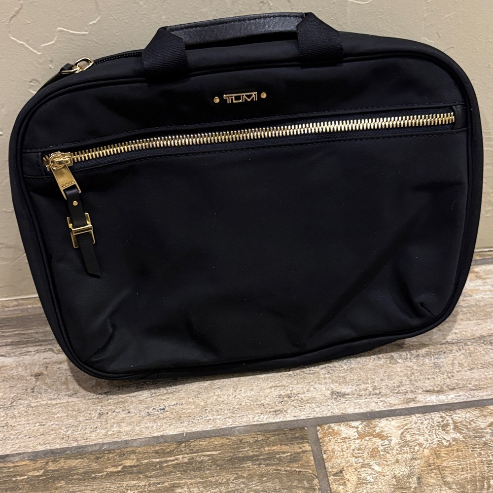 TUMI Black Toiletry Bag with Gold Accents